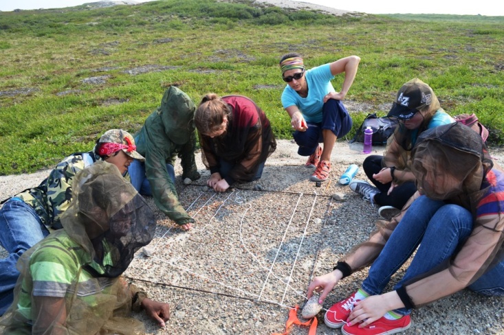 Roman Lamouelle (second from left) taking part in caribou photo survey exercise during Tundra Science and Culture Camp